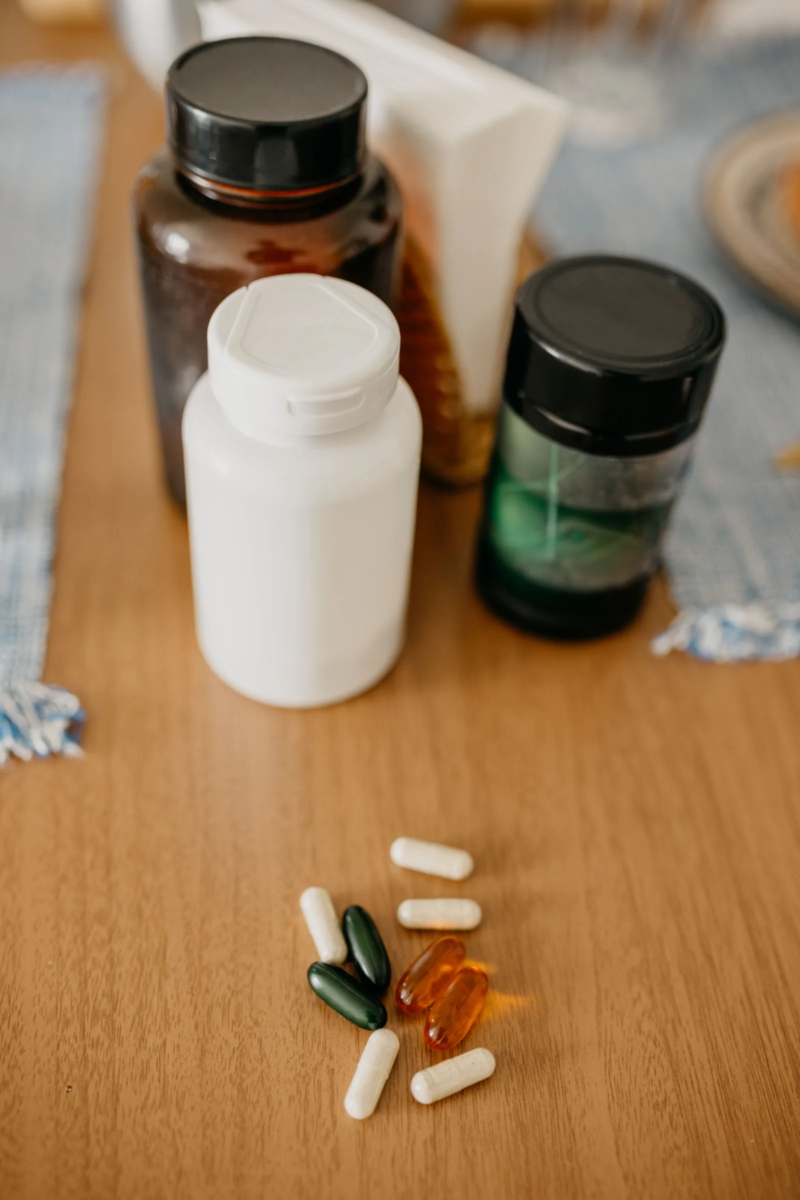 Supplement bottles and capsules on a table